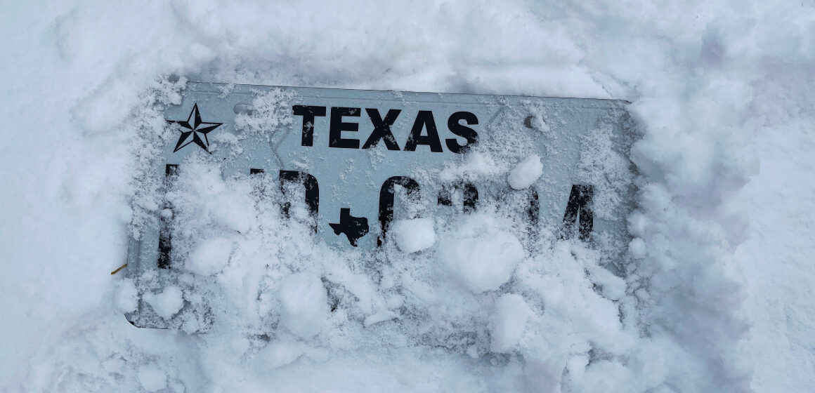 Texas license plate buried in snow